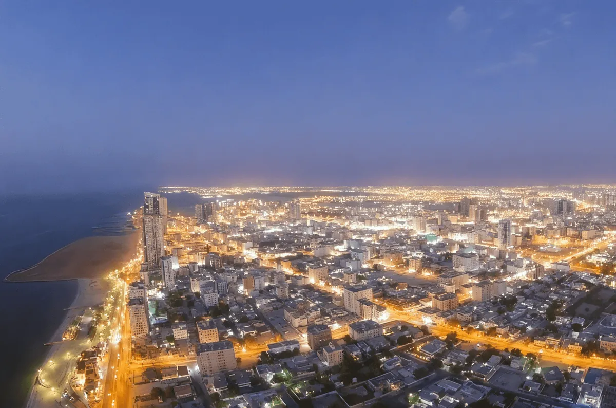 Aerial view of Ajman corniche and city at night