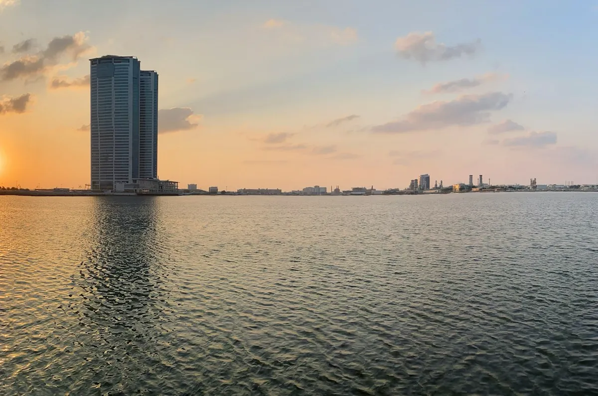 Ras Al Khaimah waterfront with Julphar Towers at sunset